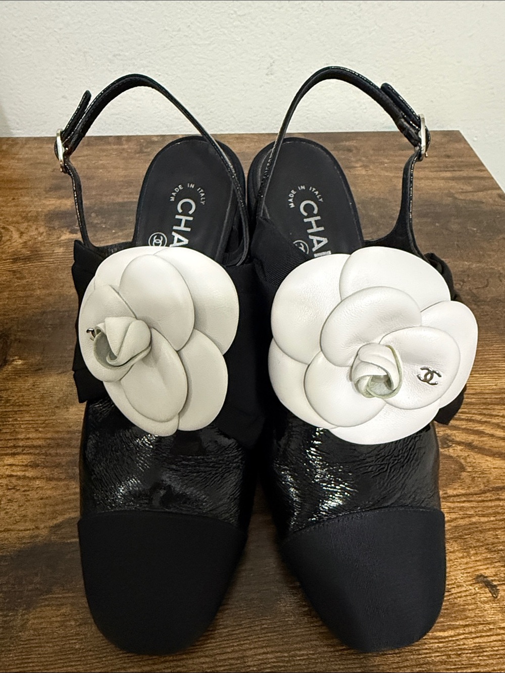 CHANEL Black Mules with White Camellia Appliqués